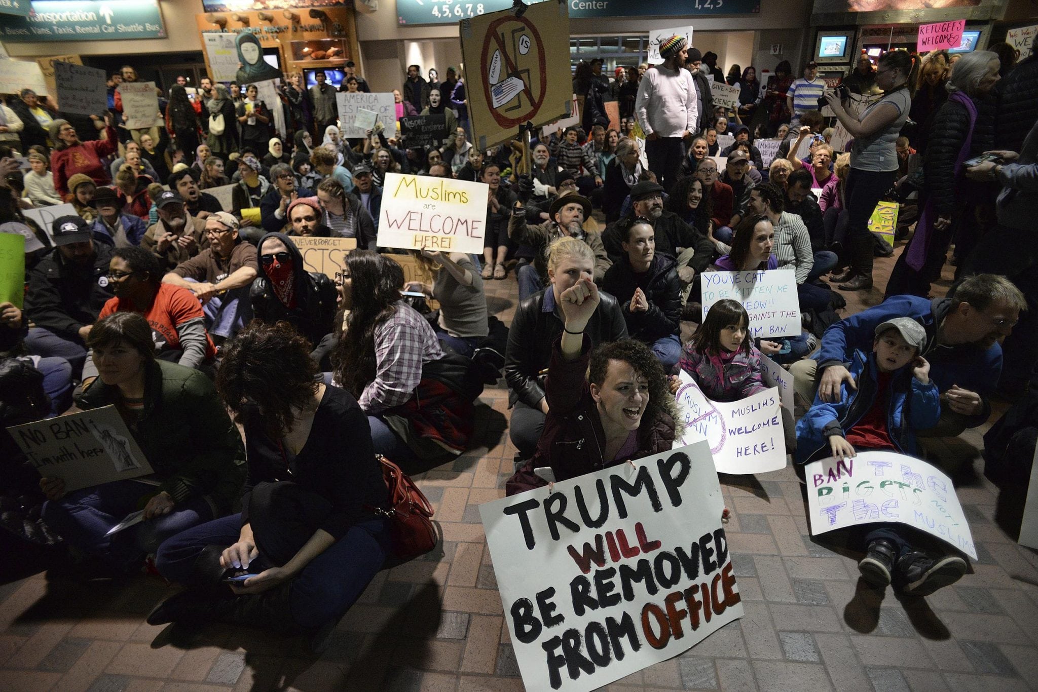 A group of 1,000 protesters took over the arrival and departure area to express their opposition to President Trump's Executive Order at Albuquerque International Sunport . 