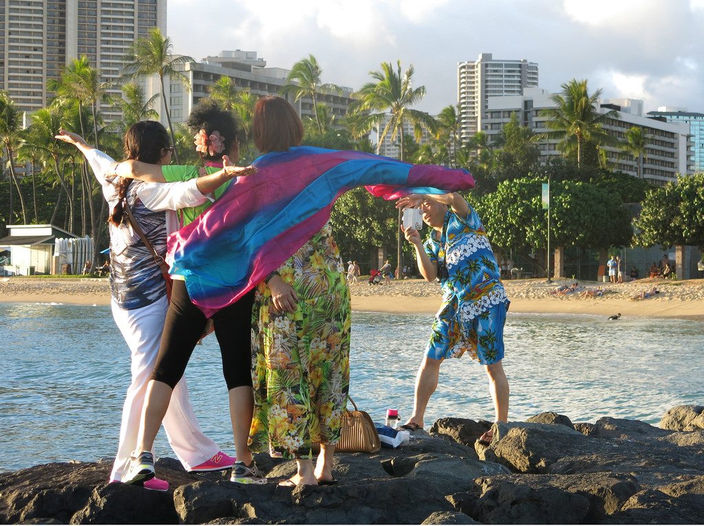 International visitor spending was up for January but some U.S. destinations didn't see positive results. Pictured are tourists in Waikiki in Honolulu, Hawaii.
