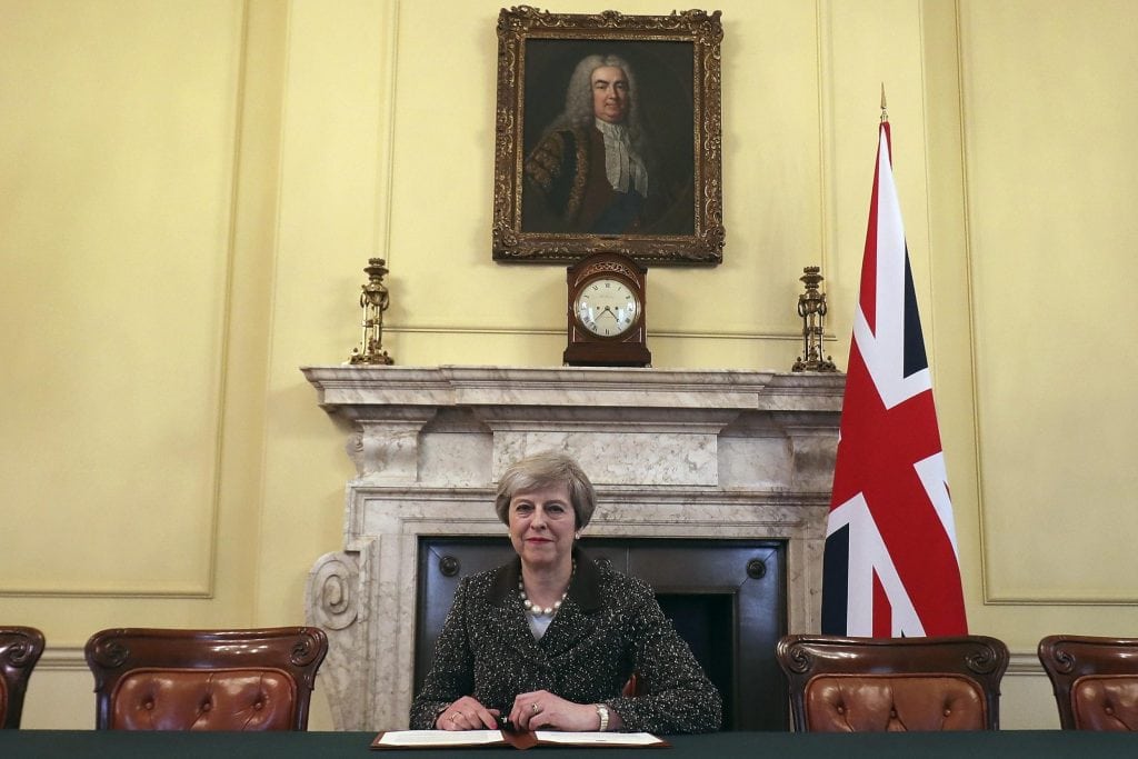 Britain's Prime Minister Theresa May signs the official letter to European Council President Donald Tusk invoking Article 50. The economic impact of Brexit has been limited so far.