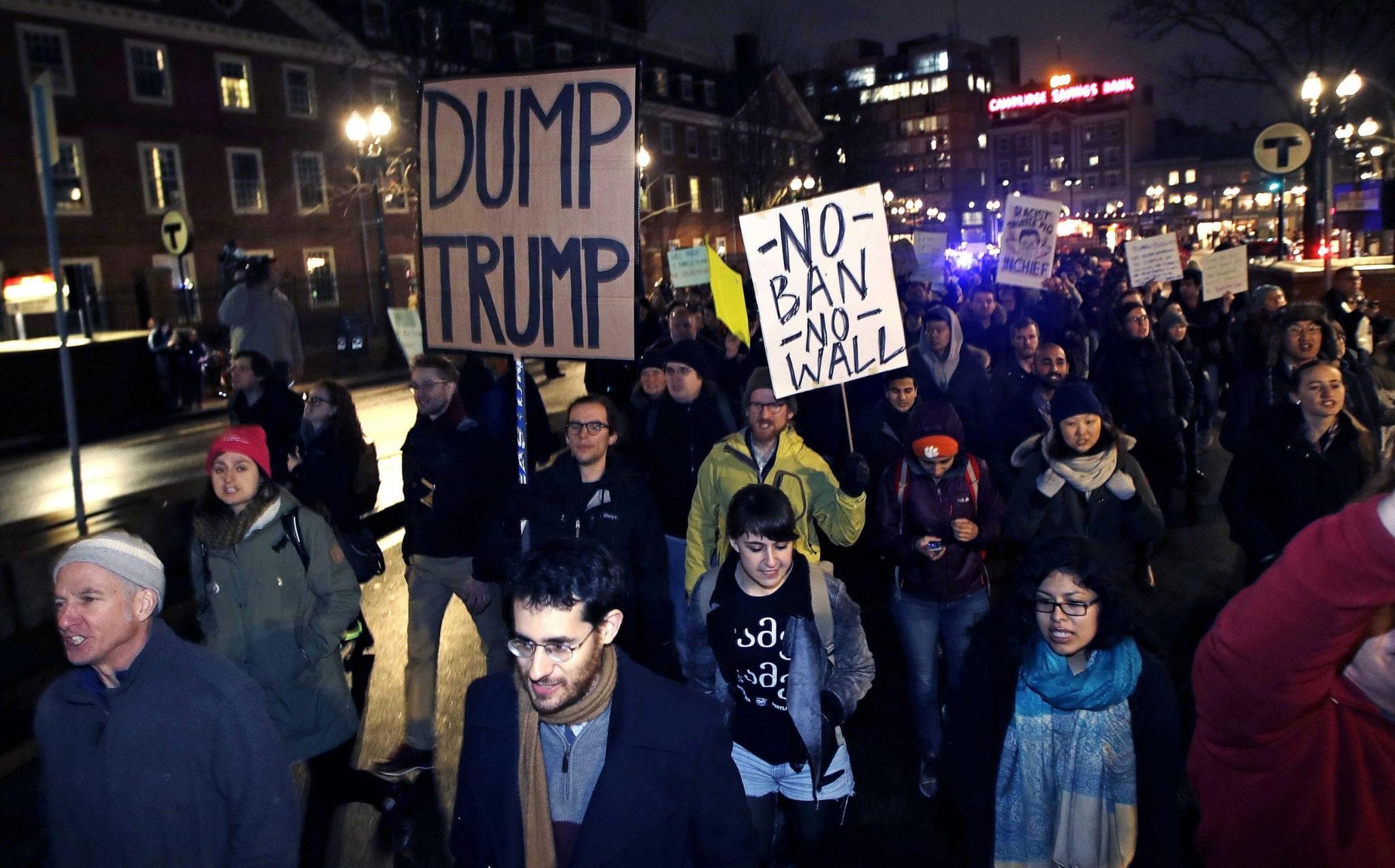 Protestors march through Harvard Square in Massachusetts to demonstrate against President Donald Trump's latest travel ban.  A new survey shows business travel is expected to be affected. 