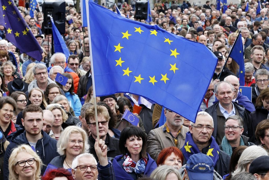 Supporters wave European flags attending a rally of the Pulse of Europe movement in Frankfurt, Germany. 