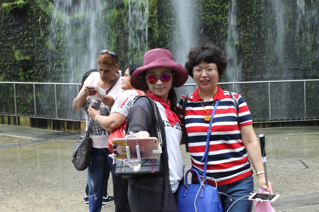 Chinese tourists, like those pictured here in Singapore, spent $261 billion on foreign trips in 2016.