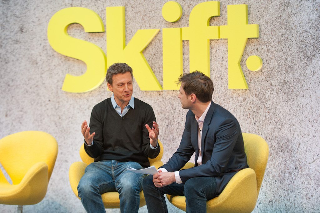 Momondo Group CEO Hugo Burge, left, speaks with Skift's Luke Bujarski at Skift Forum Europe in London in April. Burge announced Monday morning he has stepped down from the role as the acquisition of Momondo by Priceline Group closed.