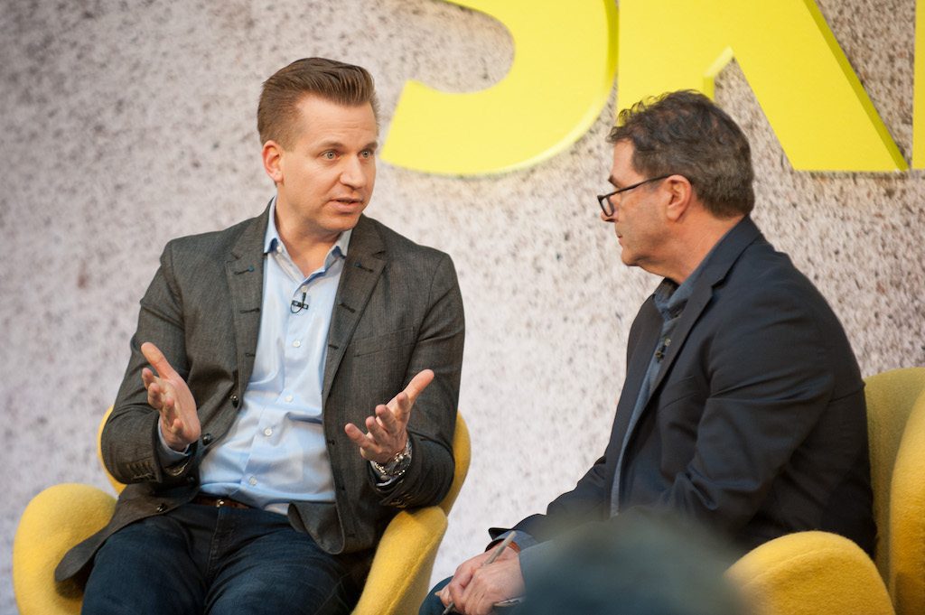 Google Travel's VP of Engineering Oliver Heckman speaking with Skift's Dennis Schaal (R) at Skift Forum Europe in London on April 4, 2017. 
