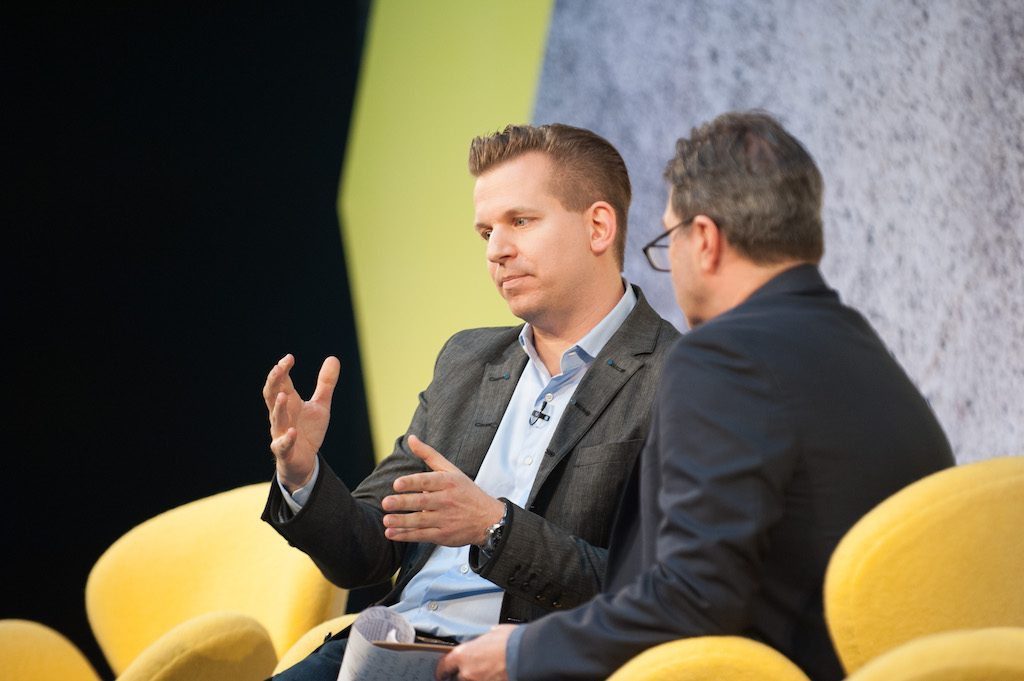 Google Travel's VP of Engineering Oliver Heckman speaking with Skift's Dennis Schaal (R) at Skift Forum Europe in London on April 4, 2017.