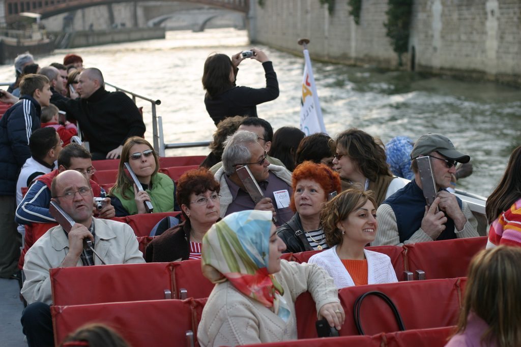 Destinations have made progress on sustainability and visas but more work lies ahead. Pictured are tourists on a river cruise on the Seine in Paris.