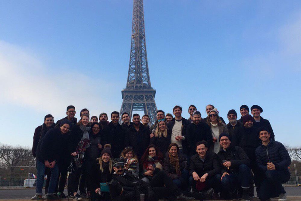 Triptease employees pose for a group photo at a Paris team meeting. The company has raised $9 million in a Series B round.