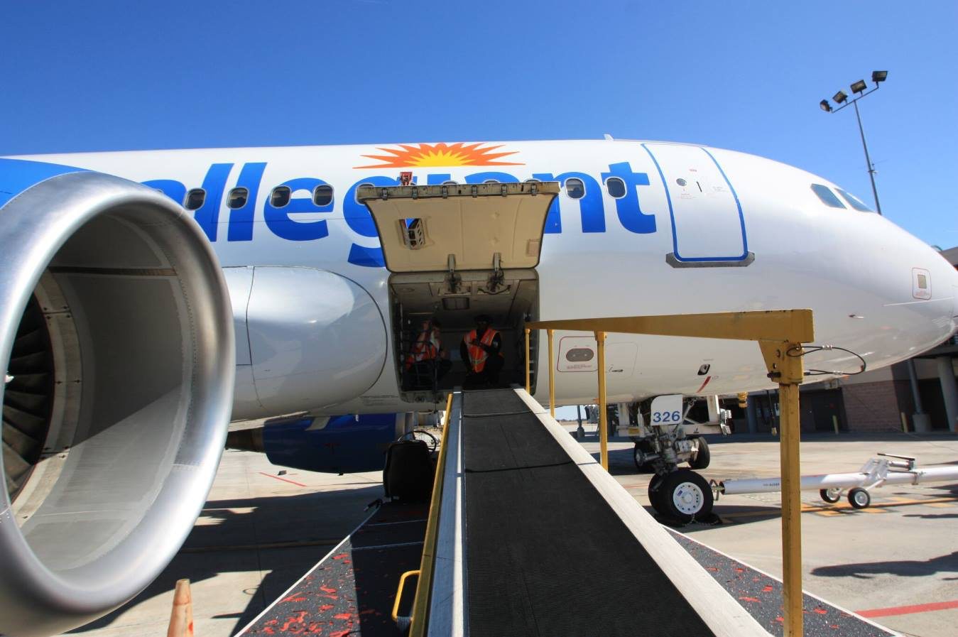 An Allegiant Air jet sits at a gate. The airline's COO, Jude Bricker, has resigned after more than a decade with the carrier. 