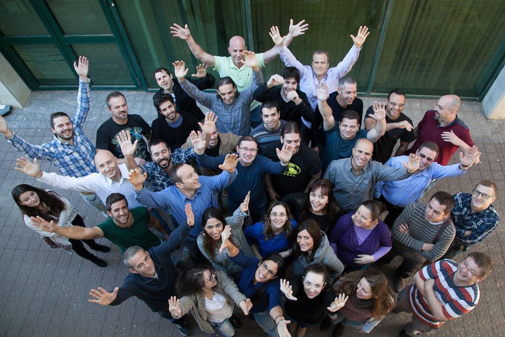 Here's Fornova's R & D team in Israel, with CEO Dori Stein in the back, with his arms raised in a light purple shirt. 