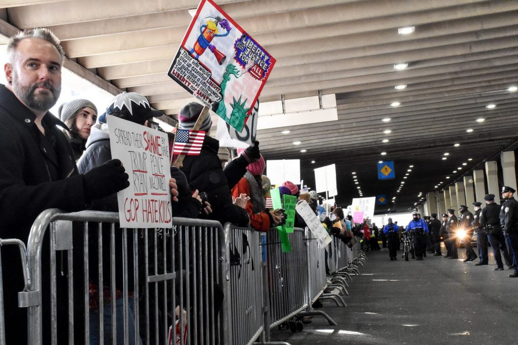 Crowds protest the first travel ban at Philadelphia International Airport in January. A new forecast from the Global Business Travel Association shows a projected $1.3 billion loss in travel spending in the U.S. this year.


