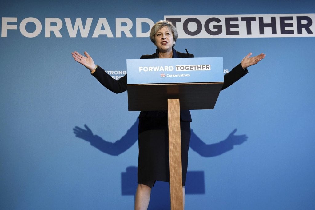 Britain's Prime Minister and Conservative party leader Theresa May gestures, during the Conservative Party manifesto launch in Halifax, England. The document does not mention tourism once.