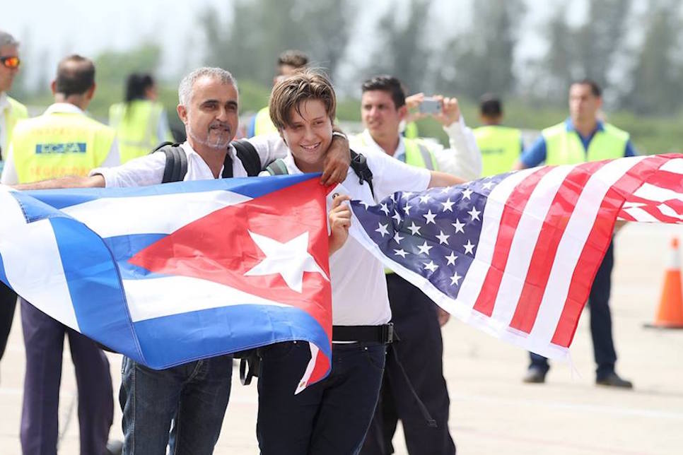 President Trump will make an announcement in Miami on Friday on the United States' official policy on Cuba. Pictured are JetBlue workers in Cuba last year.
