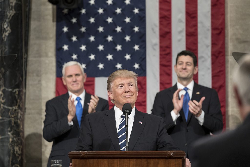 President Donald J. Trump, center, flanked by Vice President Mike Pence, right, and Speaker of the House Paul Ryan.