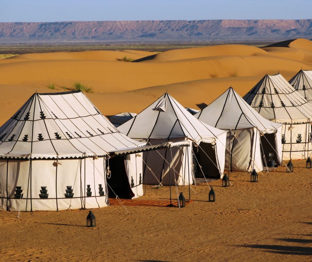 An Abercrombie & Kent safari camp constructed in the Moroccan desert. Luxury travel has evolved significantly over the years. 