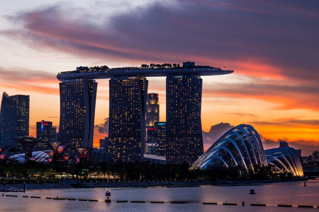 Some long-established travel agencies in Singapore have recently folded, but other companies are finding success by adapting to changing traveler behavior. Singapore's Marina Bay is pictured.