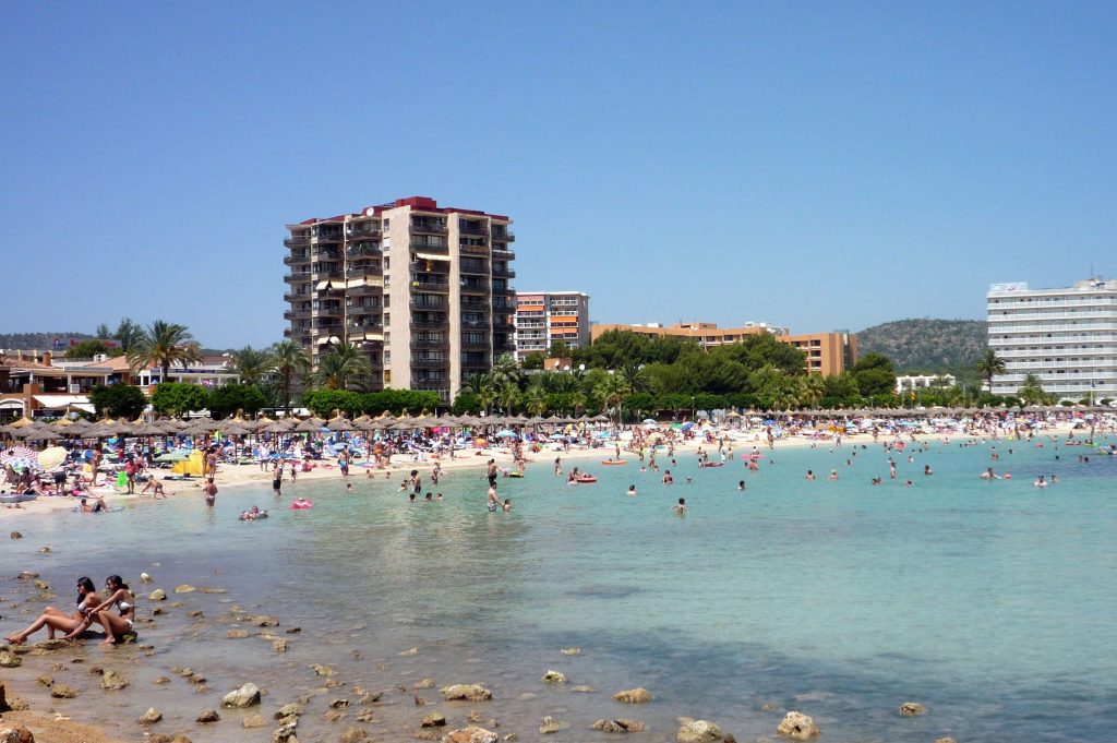 People on a beach in Majorca. The island is undergoing a tourism backlash.