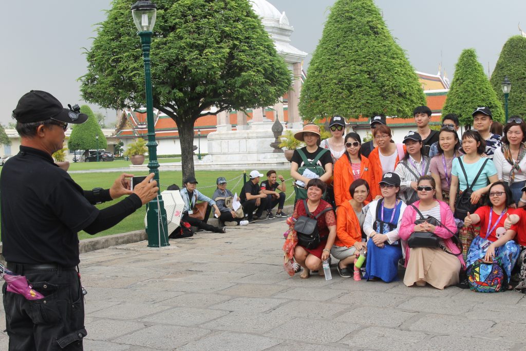 A tour group at the Grand Palace in Bangkok, Thailand, in April 2017.
