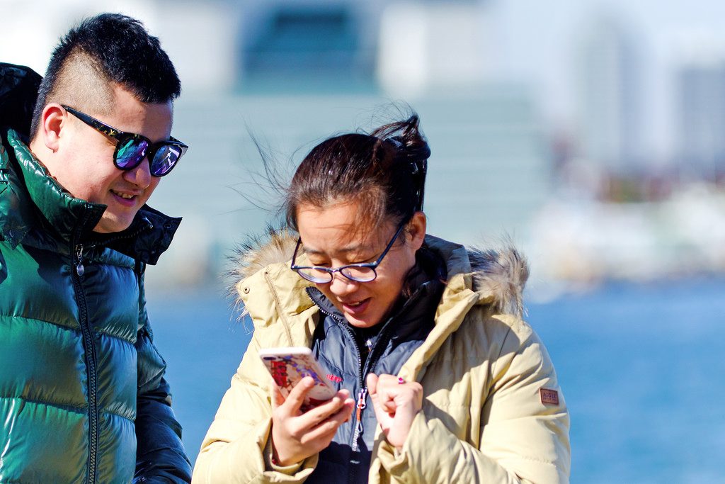 Facebook is launching its trip consideration product this week. Pictured is a Chinese couple at Yamashita Park in Yokohama, Japan on February 7, 2017. 
