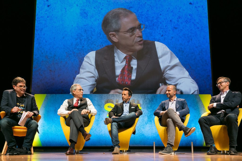 Dara Khosrowshahi (second from R) speaks onstage at Skift Global Forum 2016 alongside Rich Barton (R), founder of Expedia; Jay Walker (far L), founder of Priceline Group; and Rich Barton, (L) CEO of Altimeter Capital. 