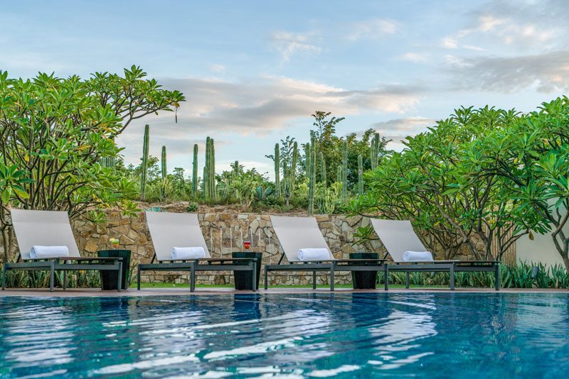 Poolside at Nekupe, a luxury resort helping local communities benefit from tourism. 