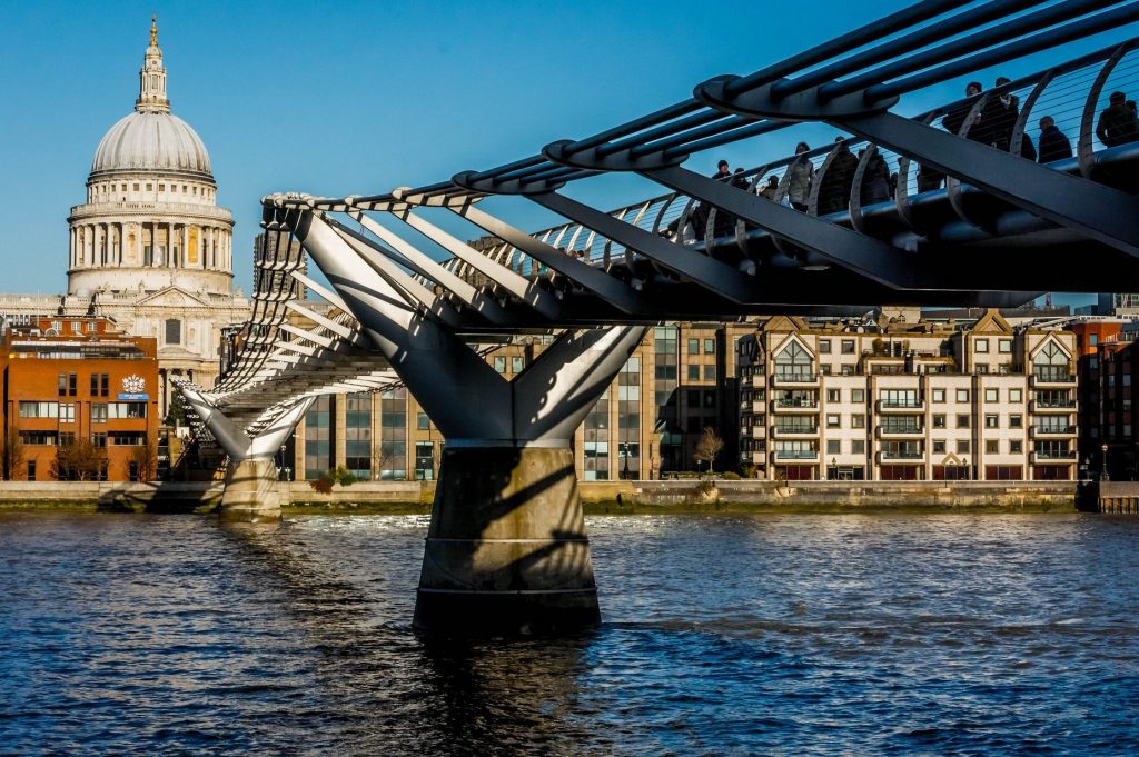 Business travel to and from the UK has fallen this year, which some believe is a result of the uncertainty caused by the Brexit vote. In this photo, crowds walk over the Millennium Bridge in London.