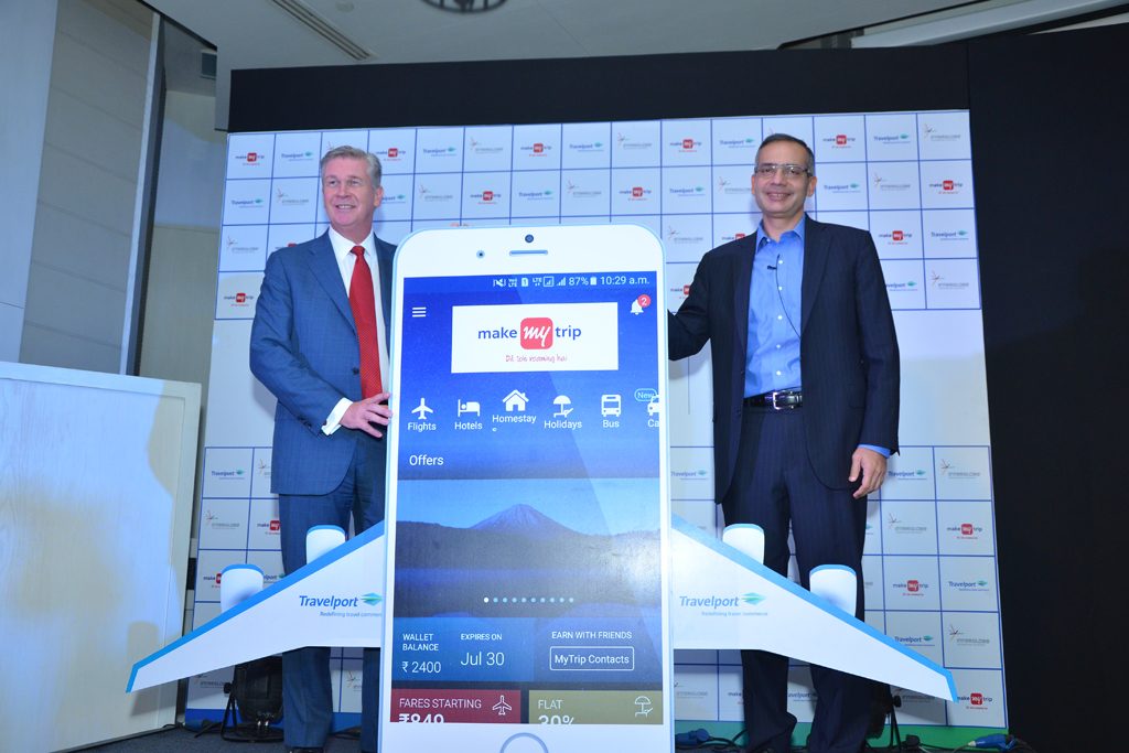 Travelport CEO Gordon Wilson (left) and his counterpart at India's MakeMyTrip, Deep Kalra, marked their new partnership in New Delhi August 23, 2017. 