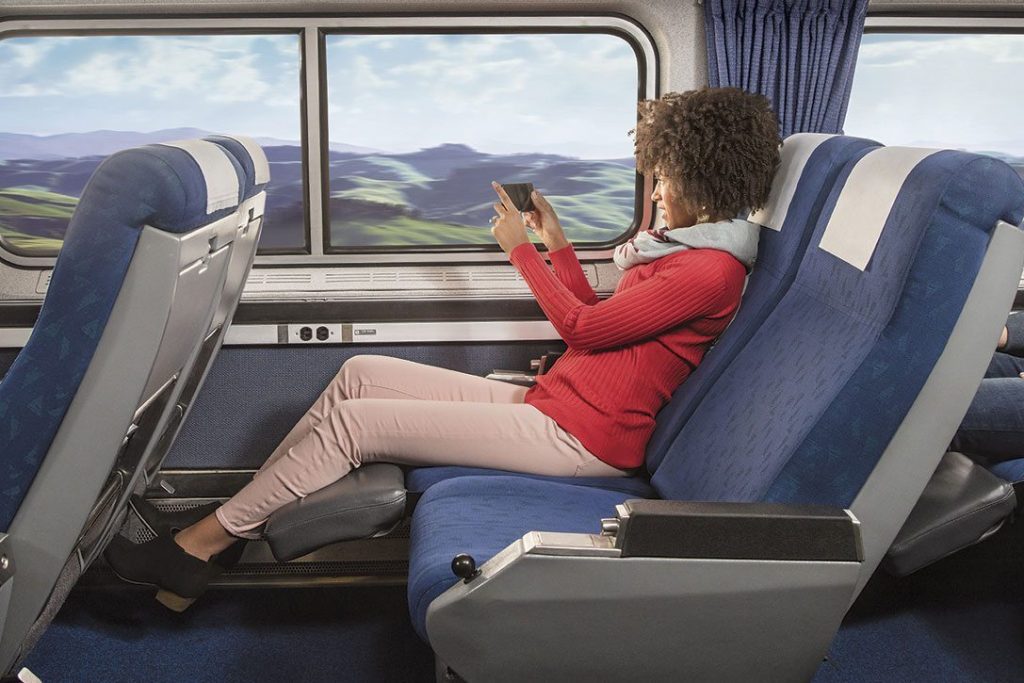 Amtrak is trying to capture new customers who are sick of flying uncomfortably Amtrak's latest ad campaign is pictured here. 