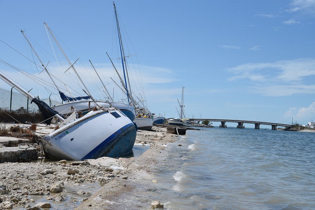 It's been a tough year for Florida's tourism industry. Pictured are boats littering the shoreline near Naval Air Station Key West on Sept. 15. 