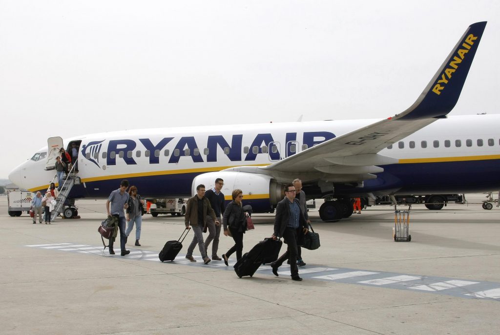 Passengers disembark a Ryanair plane May 13, 2015, at the Marseille Provence airport in southern France. Ryanair has ambitions in several areas outside aviation. 