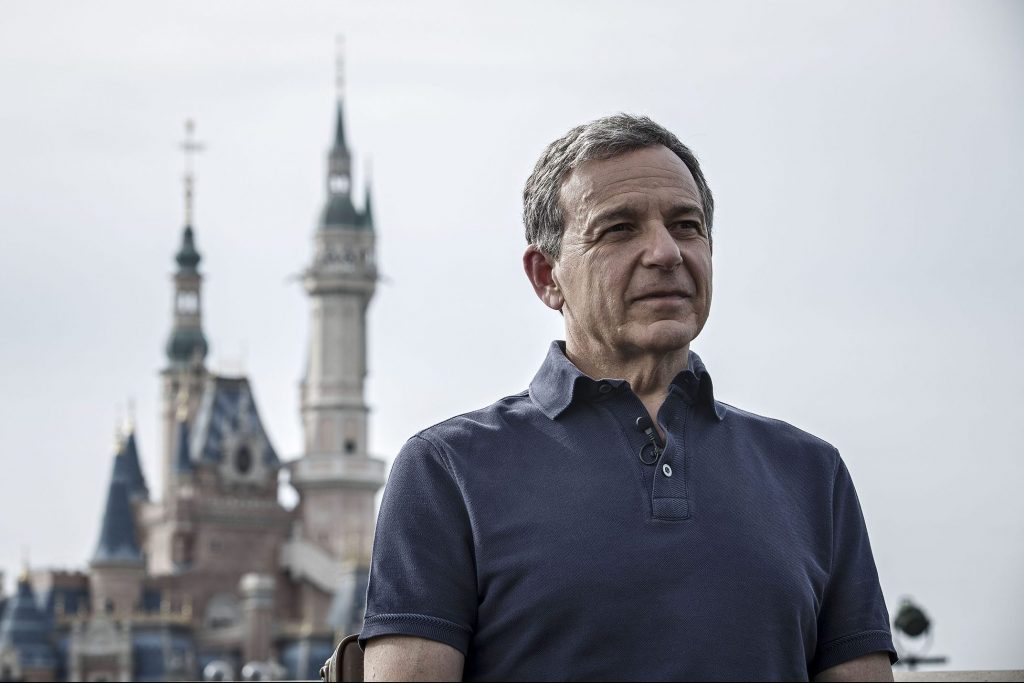 In this photo, Disney CEO Bob Iger is shown with the castle at Shanghai Disneyland in the background. The entertainment giant is taking new steps to address disruption.