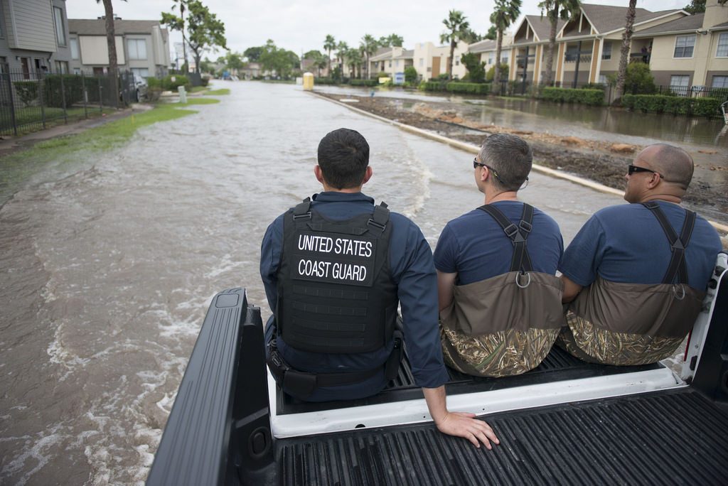 Hurricane-ravaged destinations are launching marketing campaigns to try to move past the storms. Pictured are members of the U.S. Coast Guard in Houston after Hurricane Harvey in August.