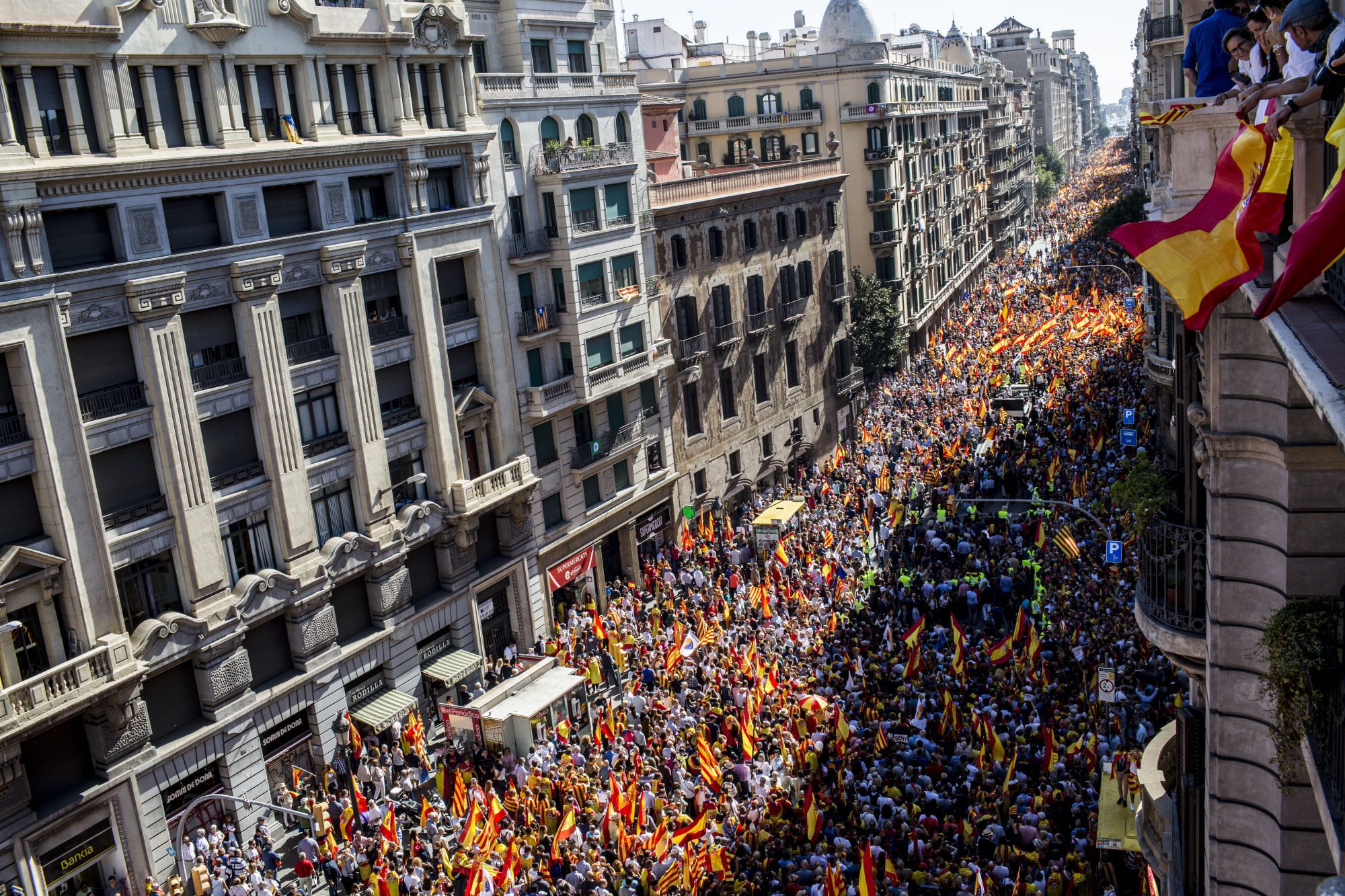 Catalan business executives stepped up their push to defuse a separatist movement as thousands gathered in Barcelona on Sunday to demand the region stay in Spain.
