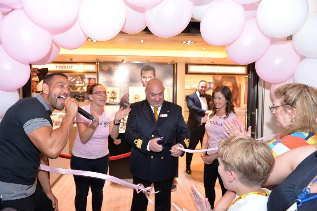 Cruise lines are trying to get smarter about the kind of retail they have on board and how they get passengers engaged with the shops. Pictured is a Pandora boutique opening on Carnival Breeze. 
