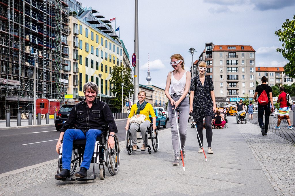 A group on an accessibility mapping tour in Berlin. Meeting planners need to craft accessibility options at the earliest stage of the planning process.