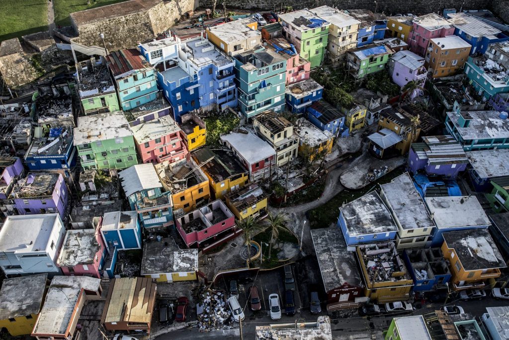 Destroyed homes sit surrounded by debris from Hurricane Maria in San Juan, Puerto Rico. The region continues to struggle. 