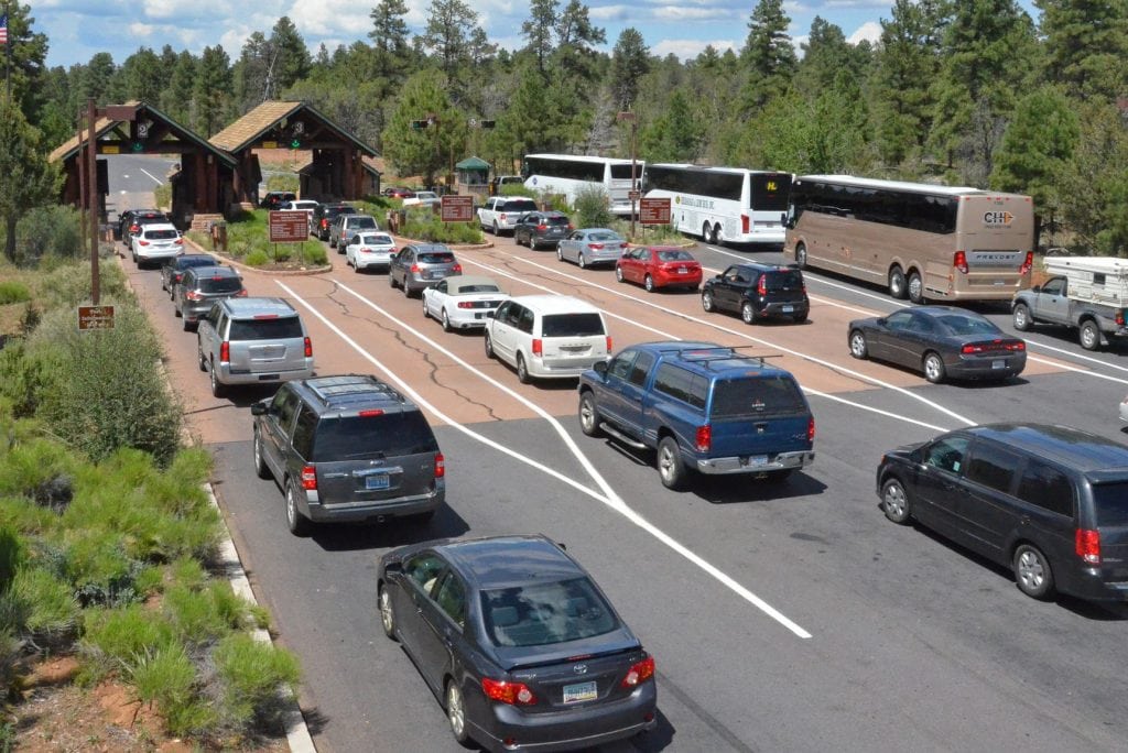 Traffic backs up at the entrance to Grand Canyon National Park. The park continues managing overtourism. 