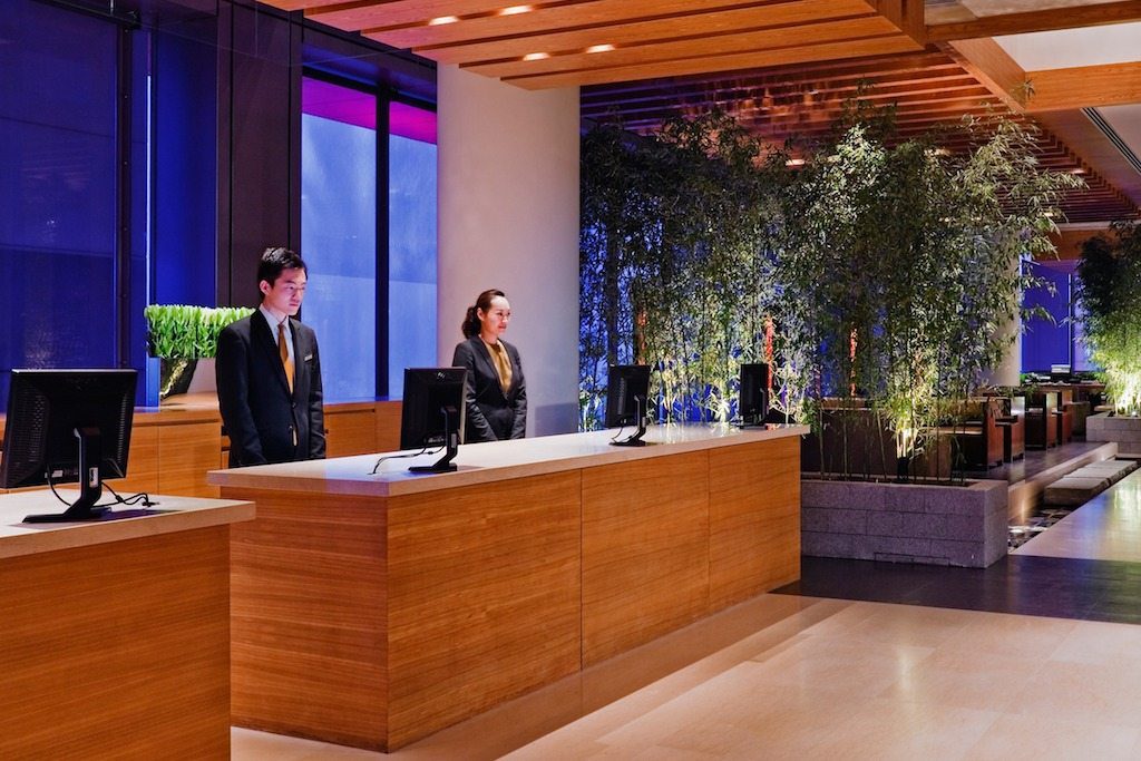A promotional photo of a Hyatt Hotels front desk. The hotel chain's new program aimed at small businesses is an interesting, but narrow, foray into business travel.