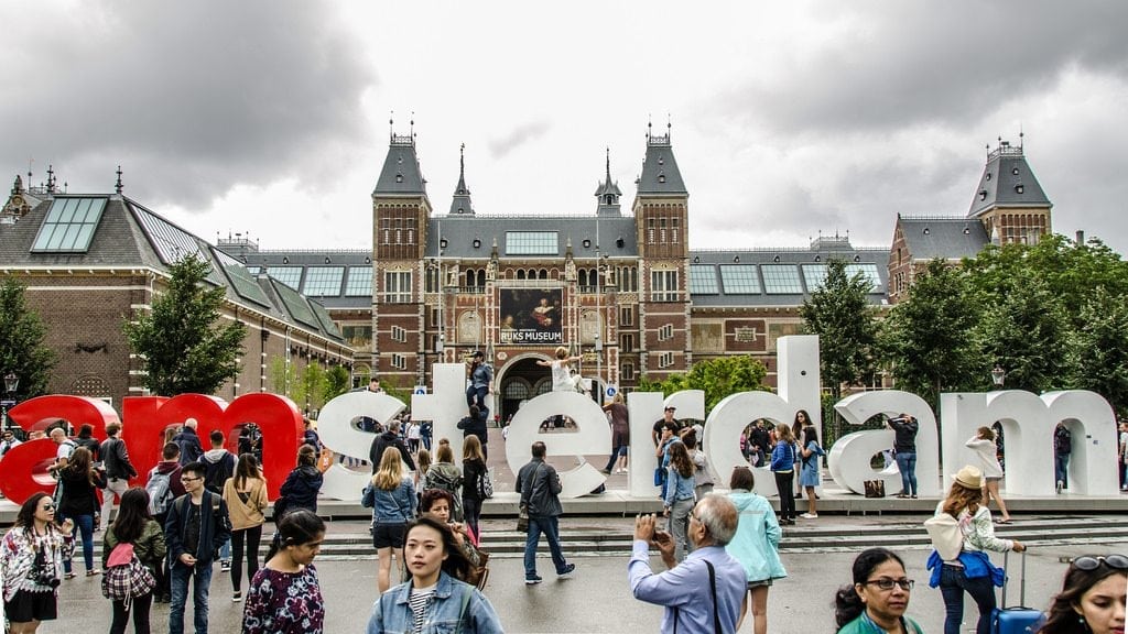 Sometimes locals contribute to congested destinations just as much as visitors. Pictured are tourists at the Rijksmuseum in Amsterdam.