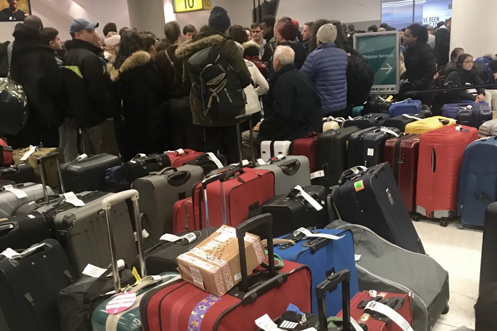 Passengers near baggage claim at JFK Airport Terminal 4 during the January 6-7 weekend. The airport had trouble recovering from a snow storm last week.