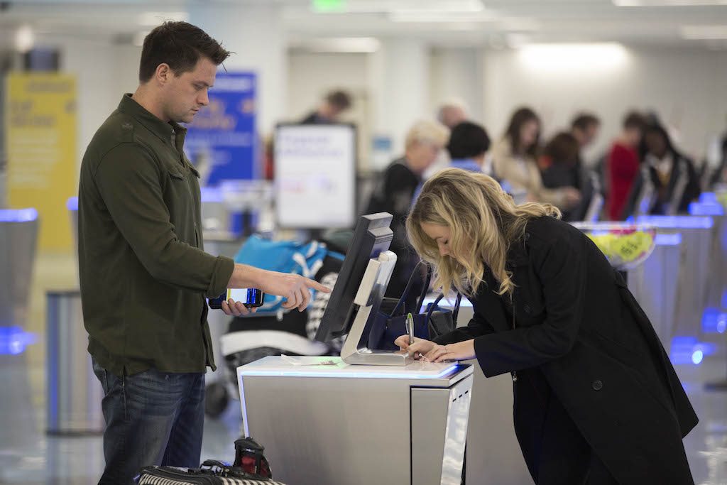 Passengers at Southwest Airlines check bags in Los Angeles. Southwest is the only major U.S. carrier that allows customers to bring two checked bags for free.