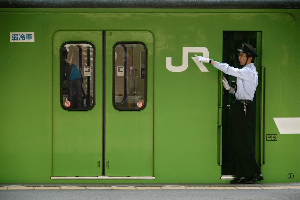 A train conductor in Japan. American Express Global Business Travel found that hotels rates, airfares, ground transportation costs, and even train fares are expected to rise throughout 2018.


