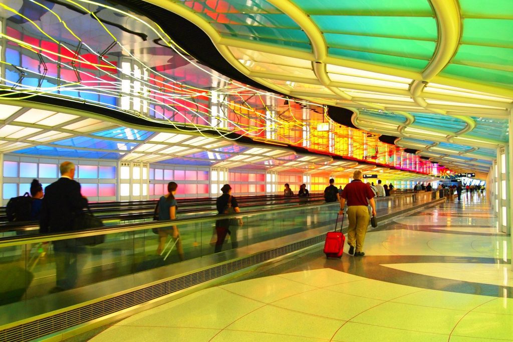 Travelers are shown at Chicago O'Hare International Airport. A healthy U.S. economy and growth in emerging markets are optimistic signs for the corporate travel industry in 2018.