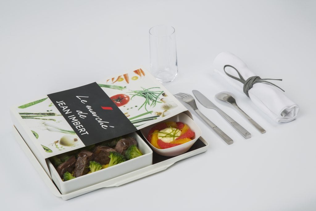 Air France is one of many airlines selling business class-style meals in economy class. 