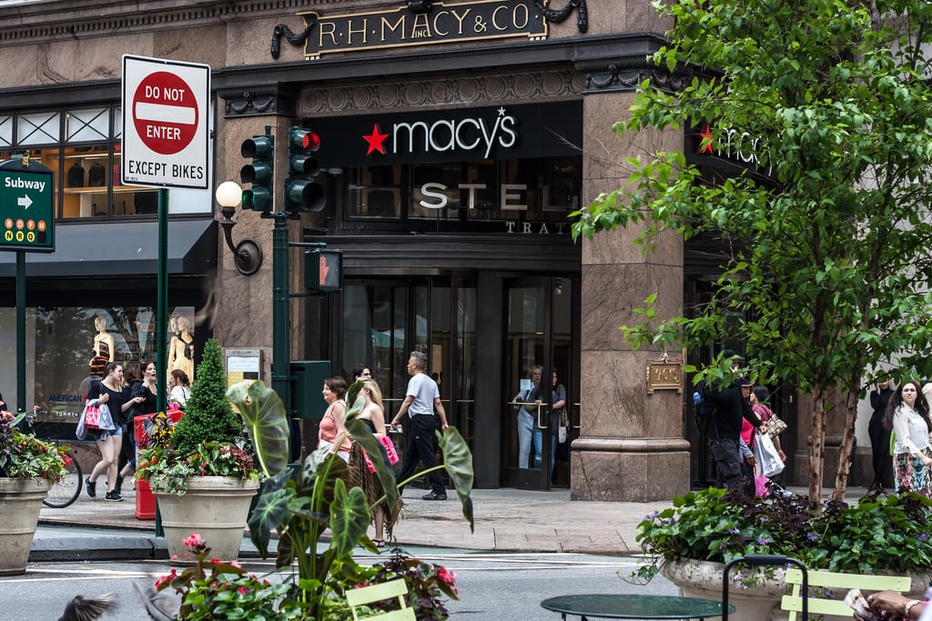 International travelers spent less in the U.S. in 2017 than they did in 2016, the second straight year of spending declines. Pictured are travelers outside Macy's Herald Square in New York City.