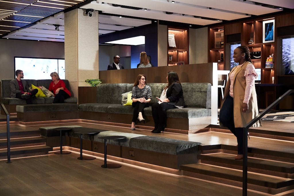 A promotional photo of Hilton's new lobby concept. Hilton is chalking up its commission cuts on hotel bookings to the need for hotel owners to spend on hotel improvements instead of distribution fees.