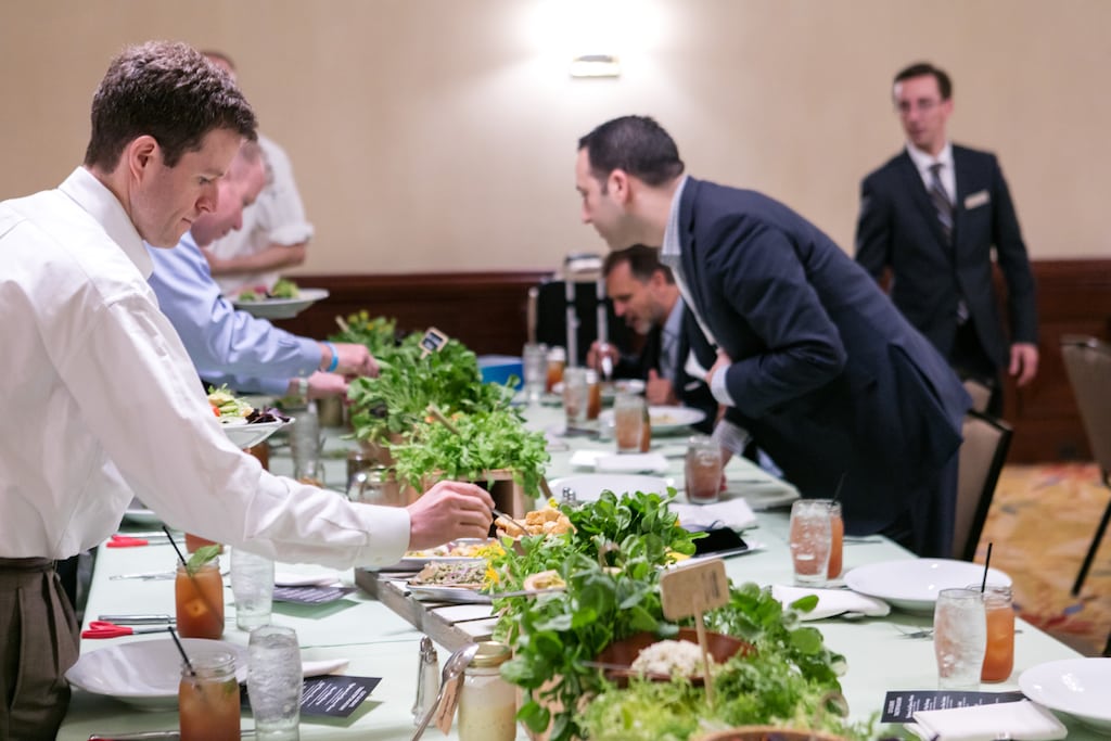 A man spoons a crouton in this promotional photo for Hilton Worldwide's meetings program. Hilton's commission cuts will put further pressure on third-party meeting planners.