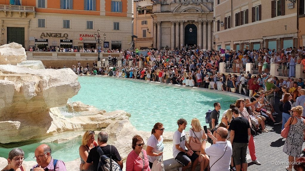Companies that arrange tours and activities, like this one at Trevi Fountain in Rome, are been on a tear recently through fundraising and acquisition deals.