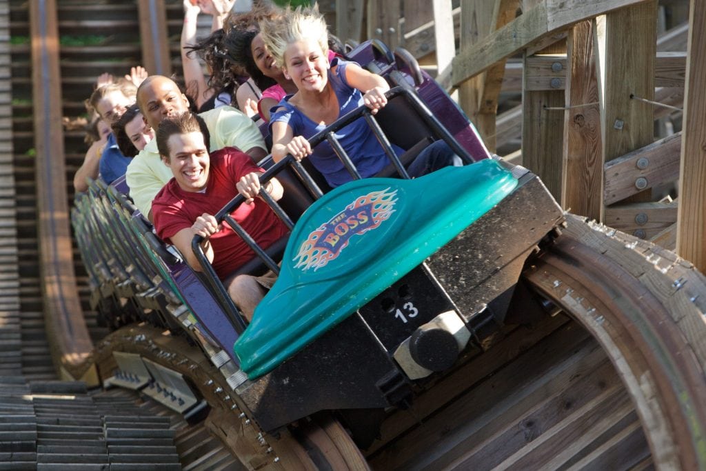 Visitors ride a roller coaster at Six Flags St. Louis in this promotional photo. Parent company Six Flags Entertainment wants to buy theme and water parks within driving distance of its existing sites as one way to fuel growth. 