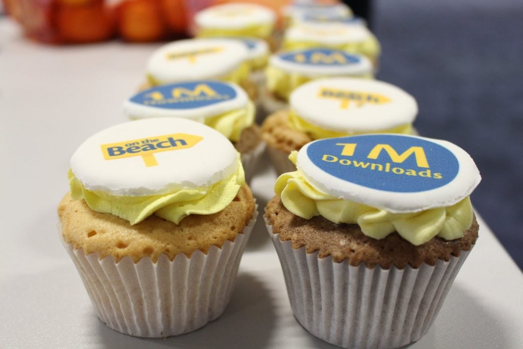 Shown are On the Beach-branded cupcakes. The online travel agency celebrated hitting 1 million downloads for its app in April.