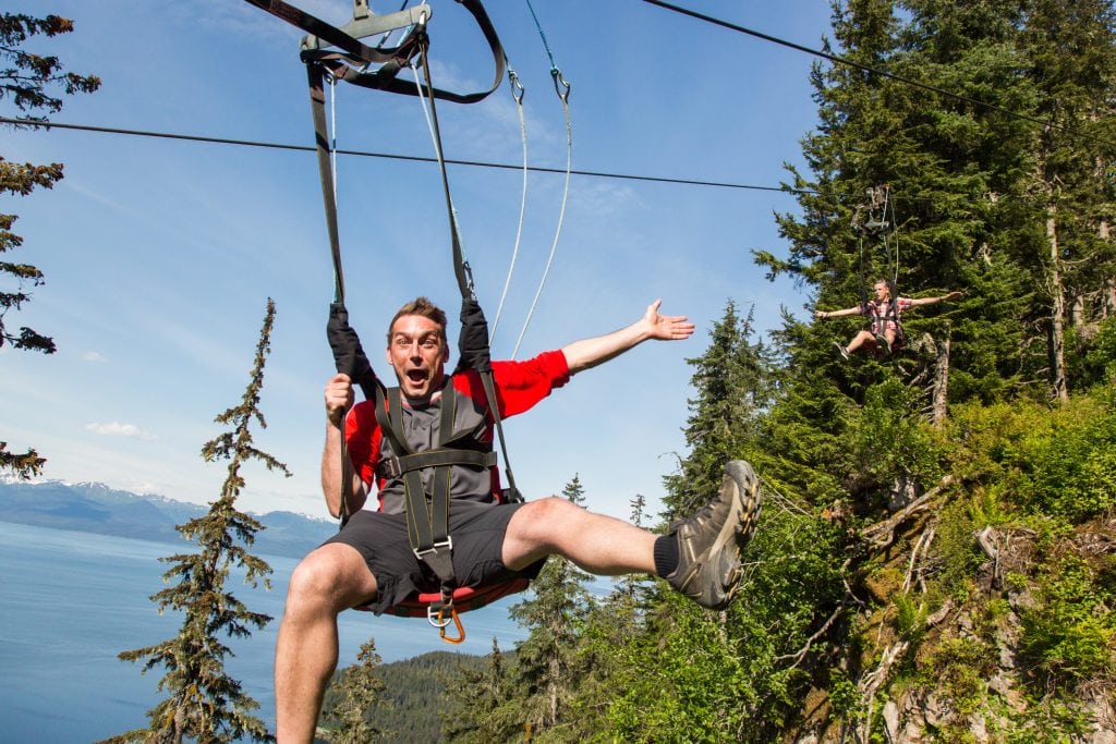 Travelers are shown on a zip line in Alaska in this promotional photo from GoBe. The tour booking site has folded a little more than a year after its official launch.
